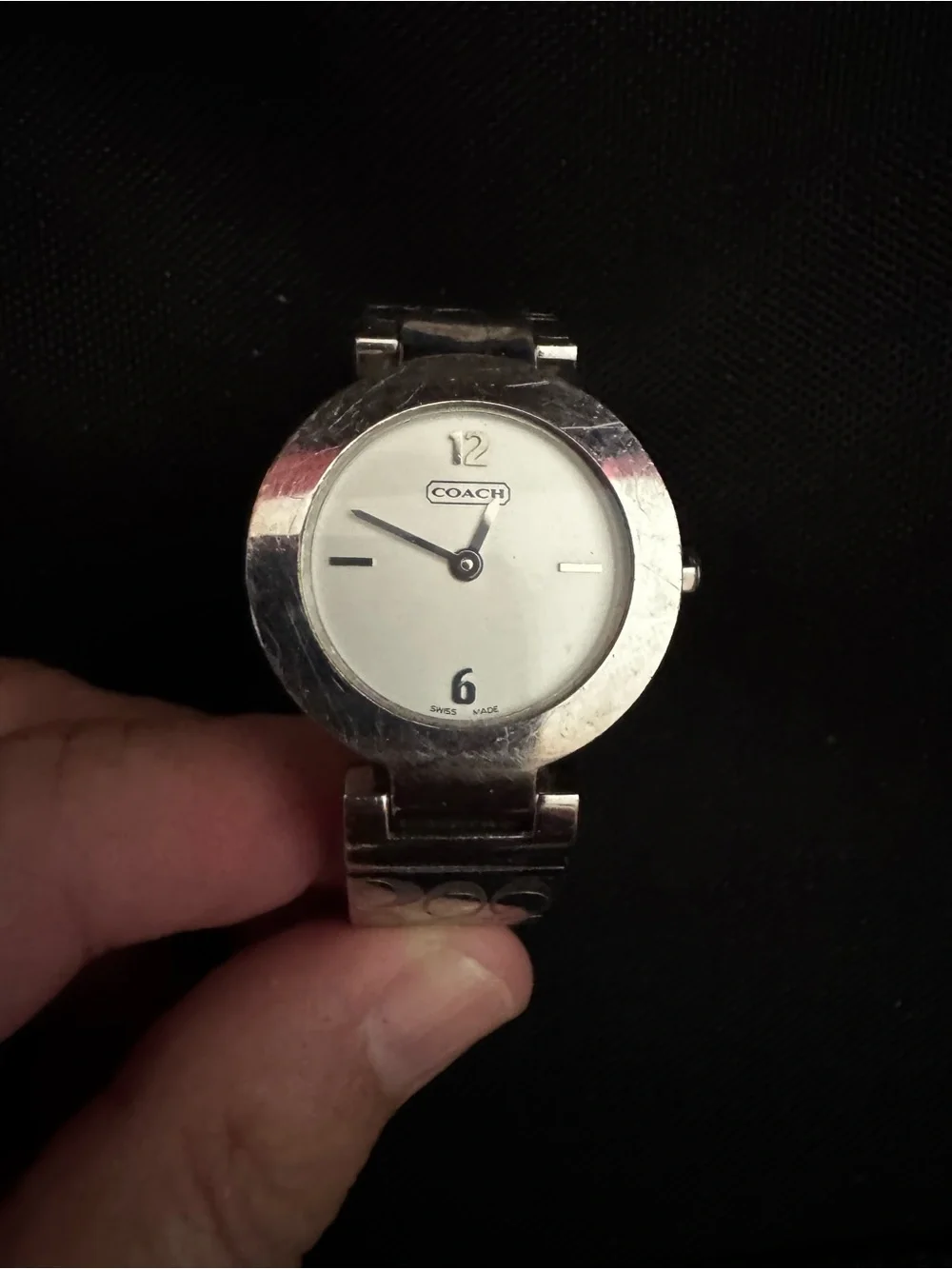 Coach polished silver